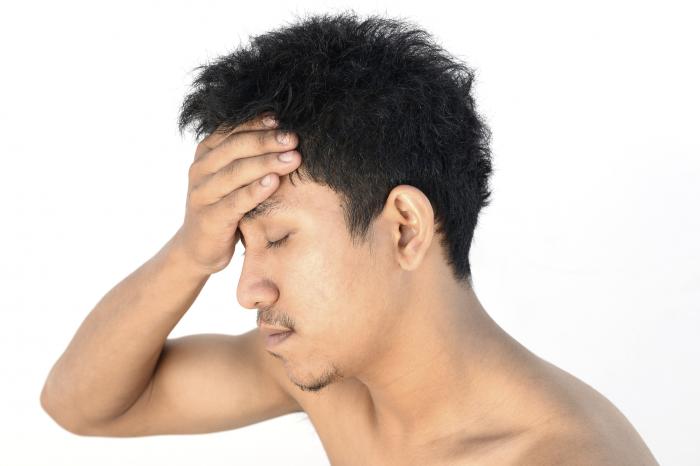 A man has a headache.