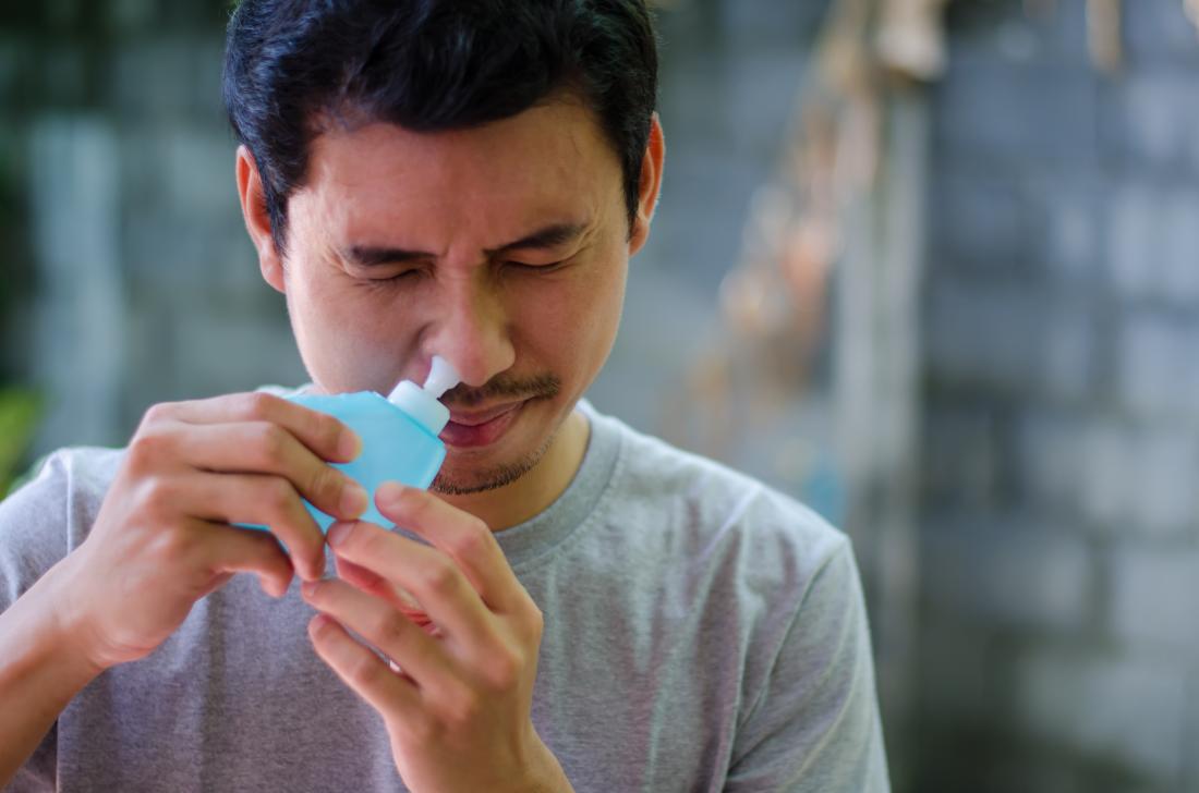Man with neti pot