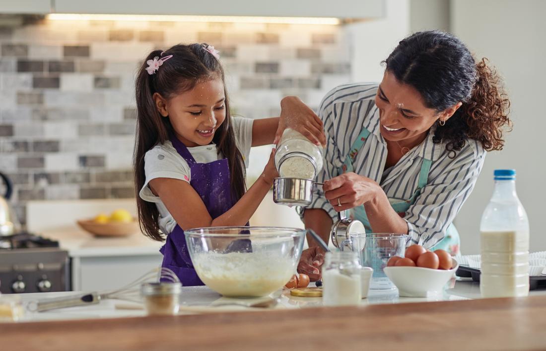 mother and daughter cooking