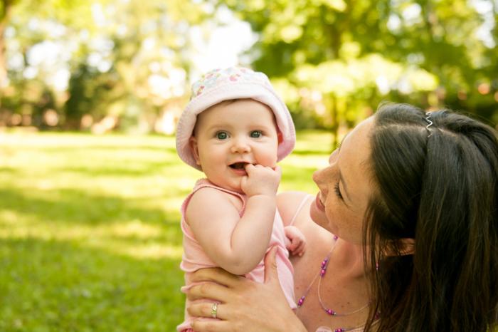 A mother in the park with her baby