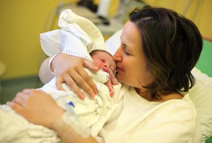 Mother holding newborn baby