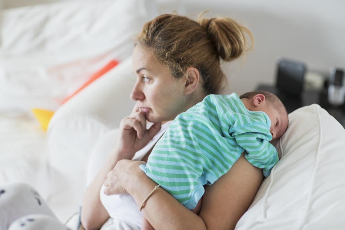 mother holding baby