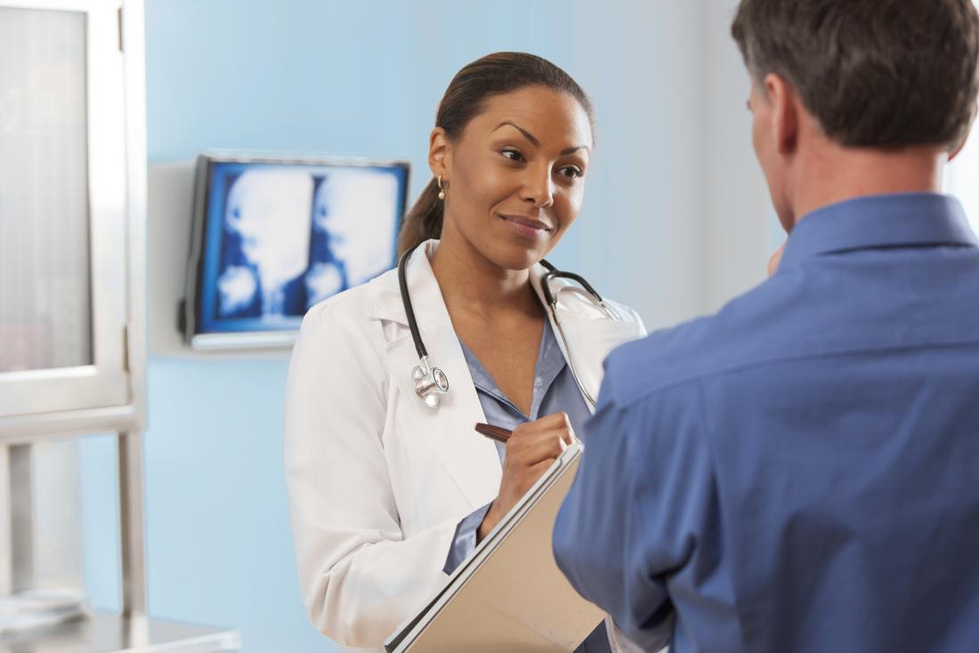 Doctor consults patient