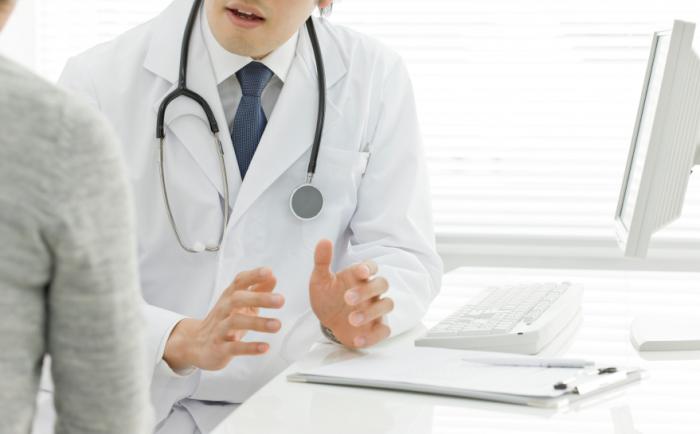 doctor talks with patient