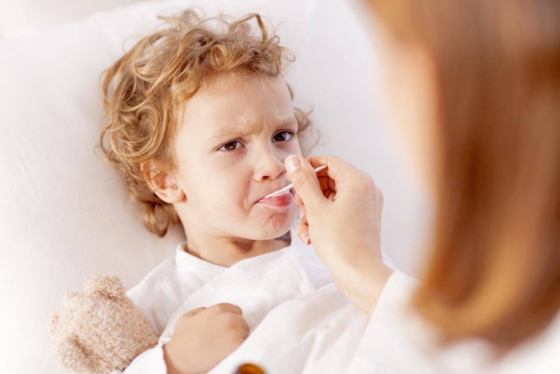 child takes medicine