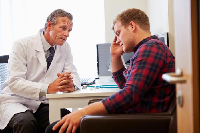 Doctor speaking to patient