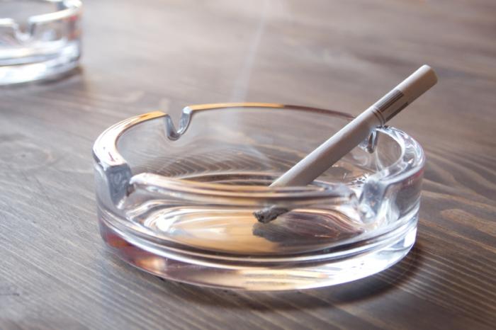 a cigarette sitting in an ashtray