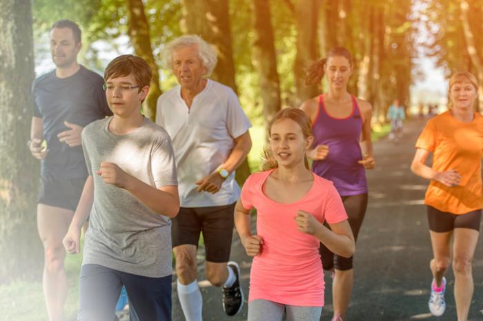 family jogging in park