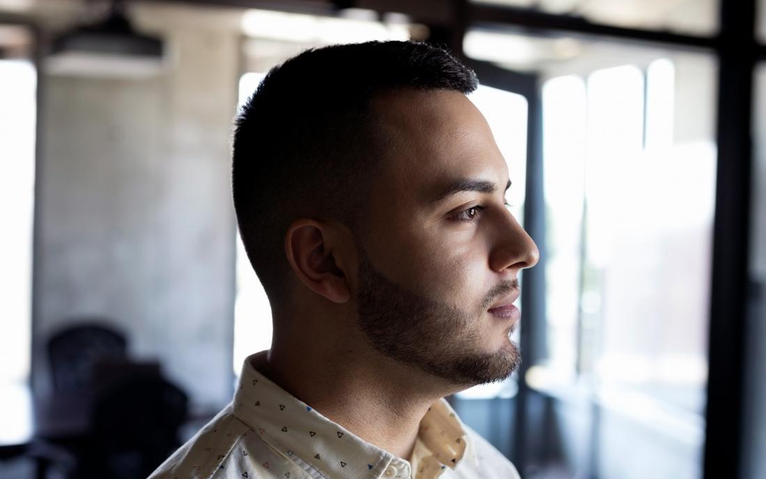 a man looking pensive because he has early signs of HIV. 