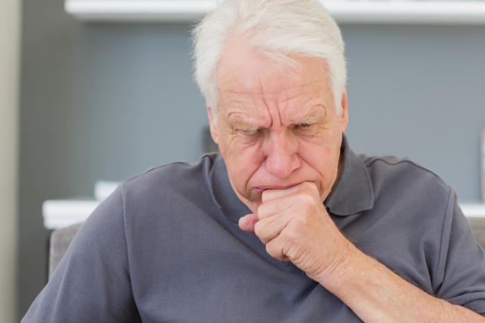 older man coughing