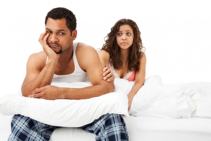 Man looking concerned in the bedroom