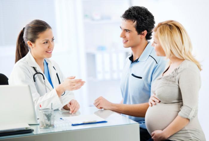 Young couple meeting with a doctor