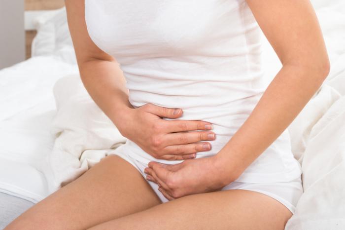 Lady holding stomach