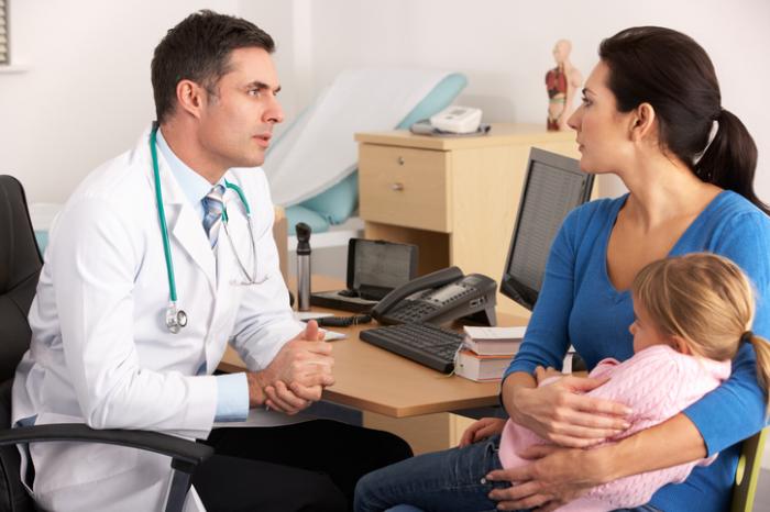 American doctor talking to mother
