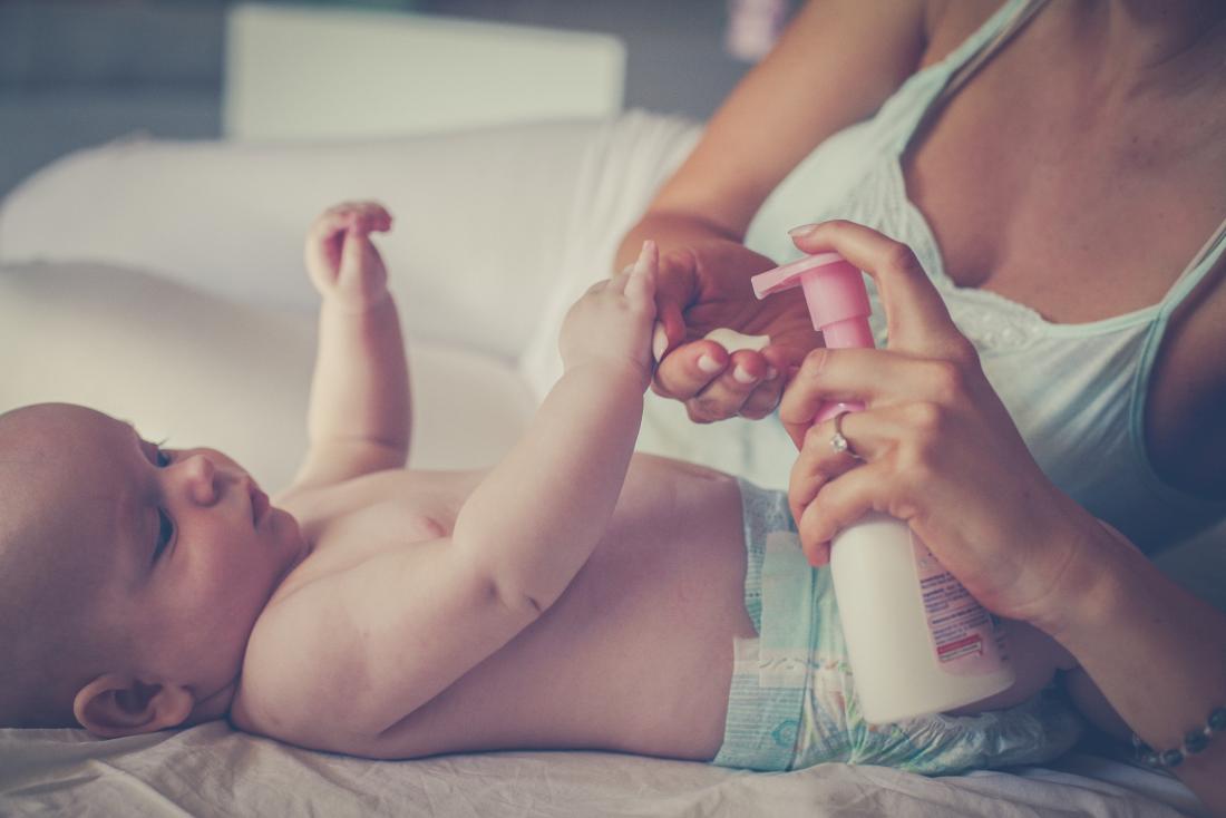 mother uses emollients on child