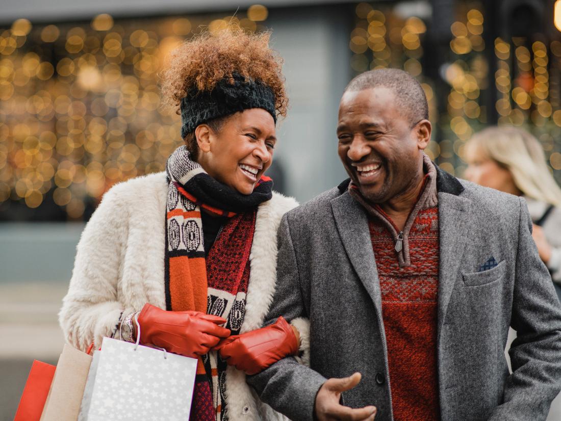 a happy couple out christmas shopping.
