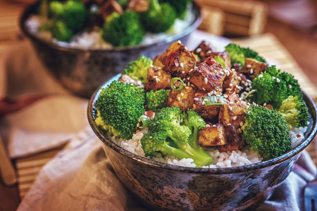 broccoli tofu rice and seeds in a bowl