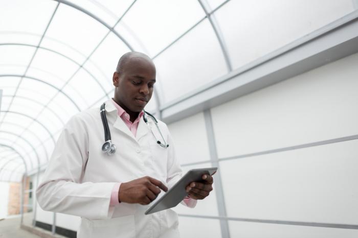 Doctor looking at ipad