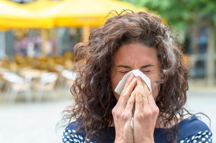 lady blowing her nose