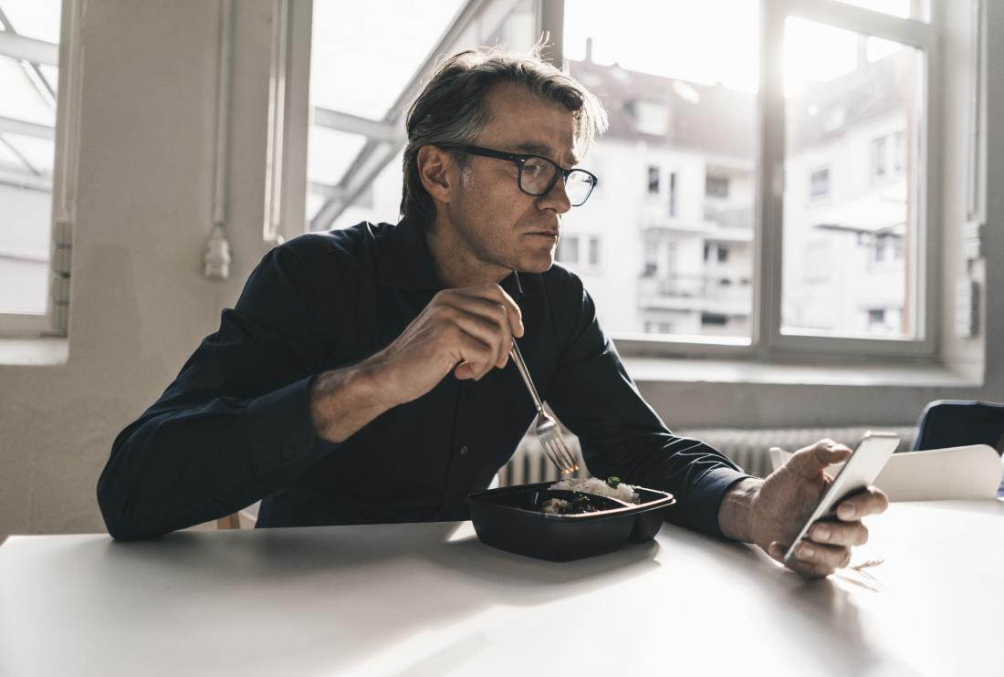 man eating processed food