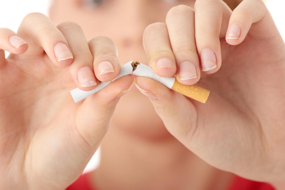 breaking a cigarette in half