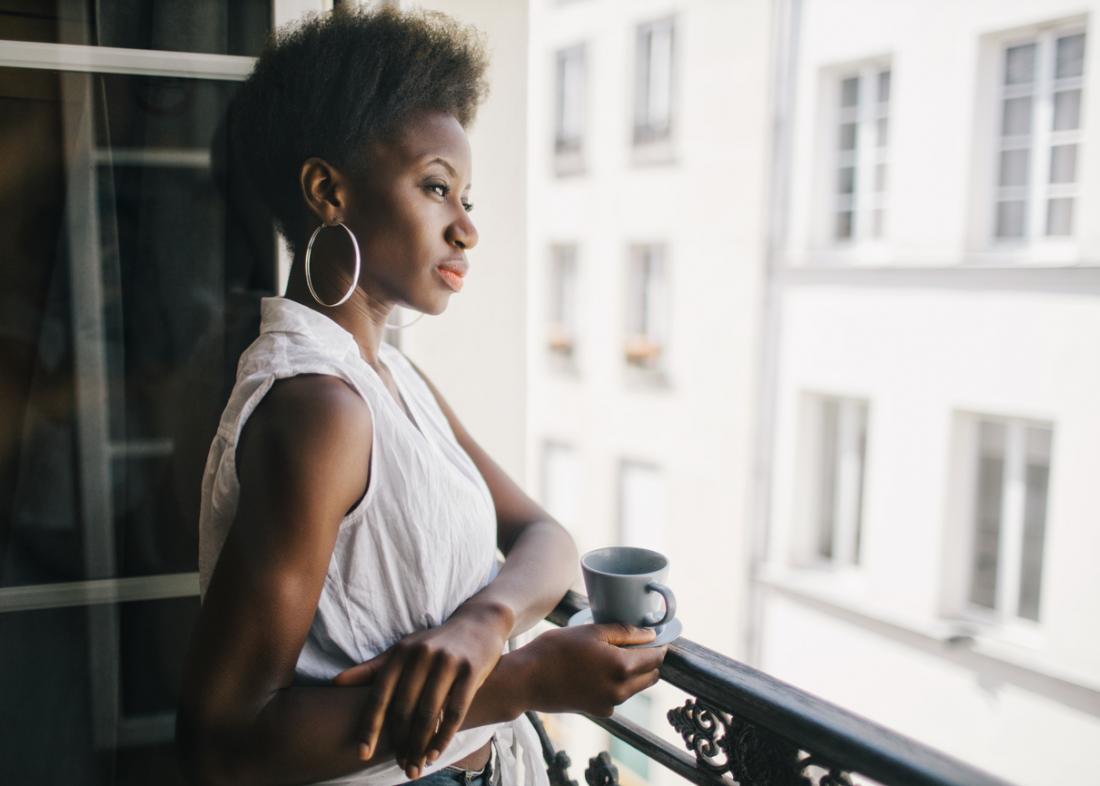 woman looking worried on the balcony