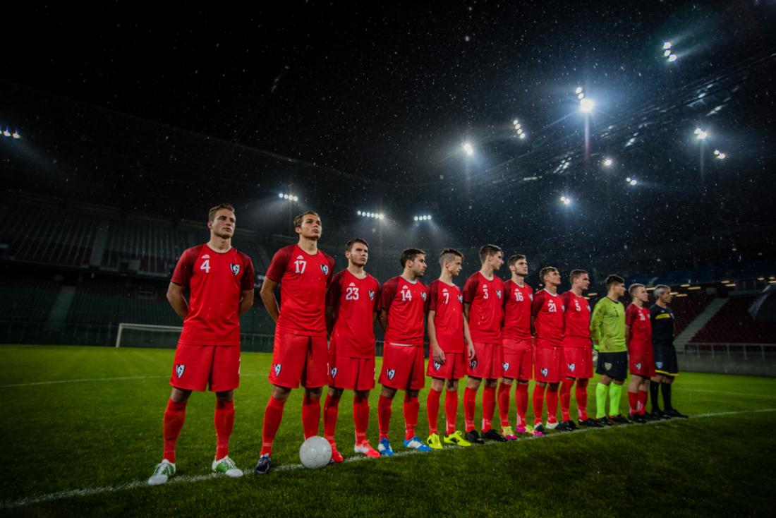 A football team lined up on the pitch