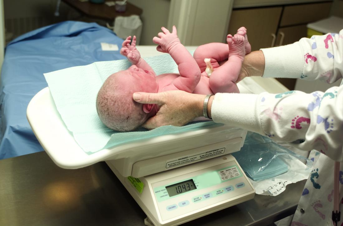 baby being weighed
