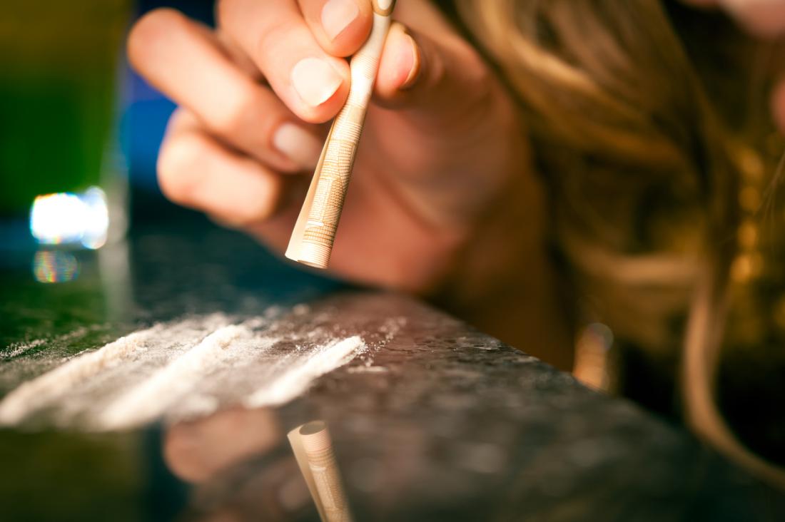 Woman taking cocaine