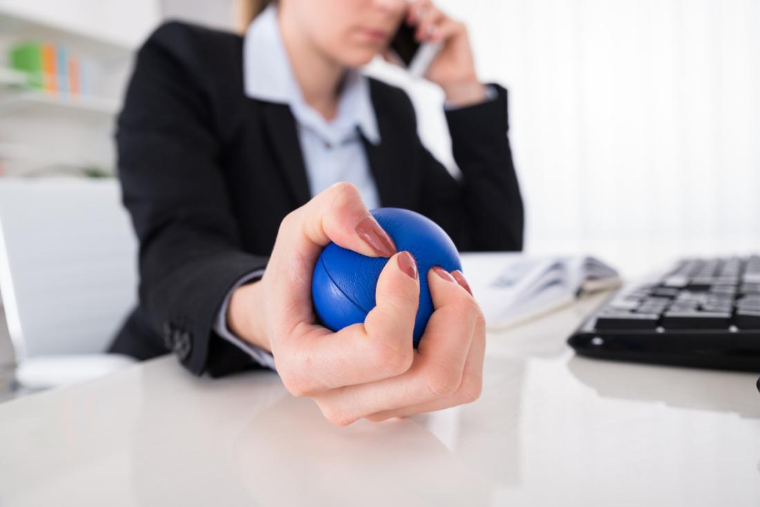 lady at work holding stressball