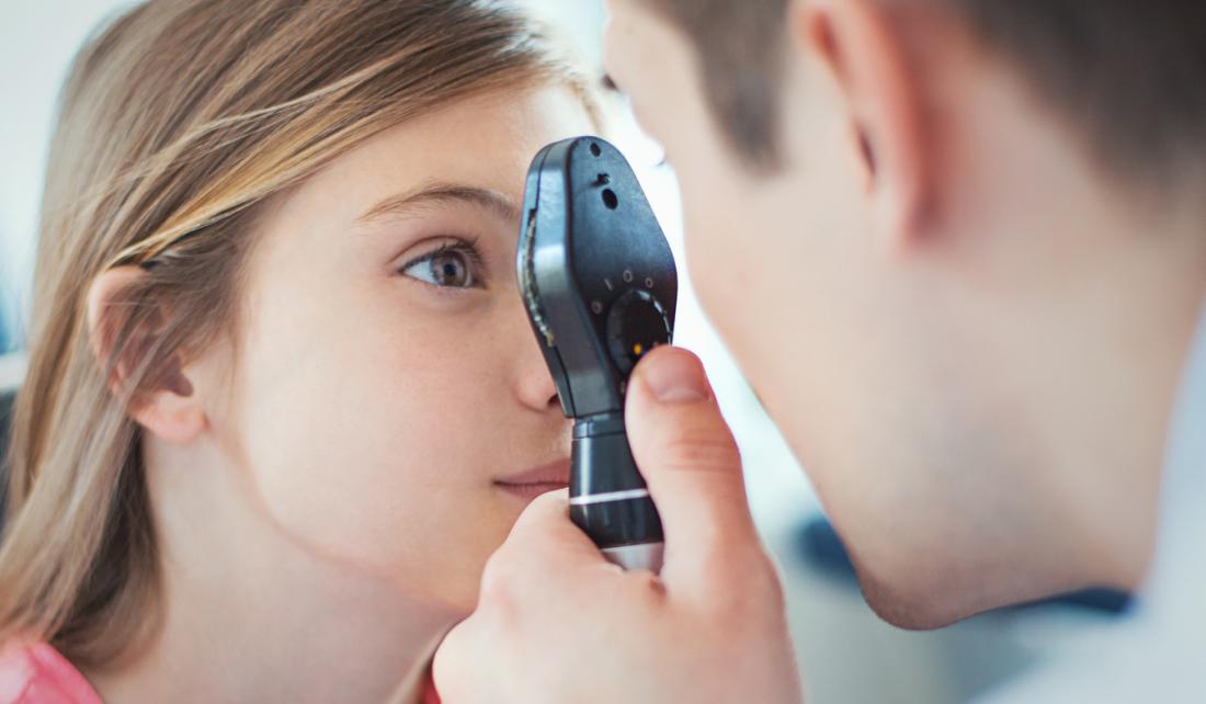 Young woman at opticians.