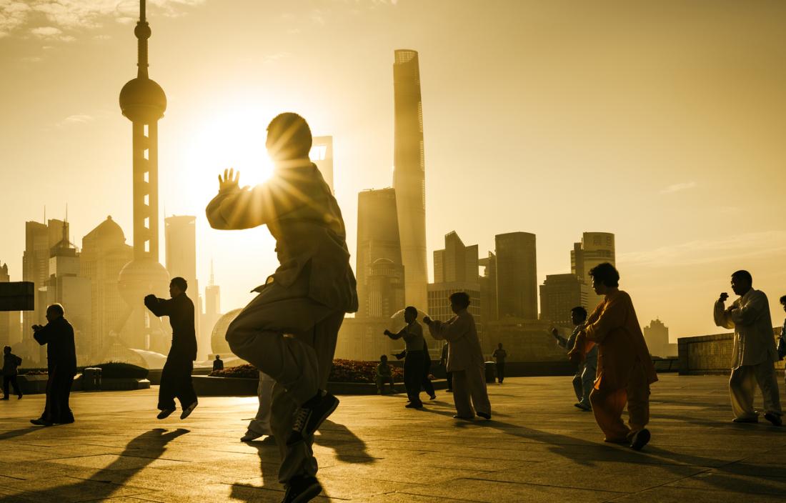 Older adults tai chi at sunset China