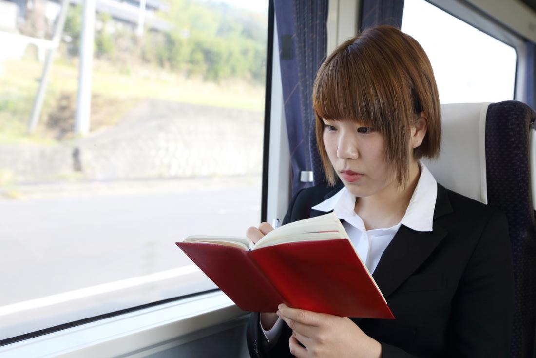 young woman taking notes