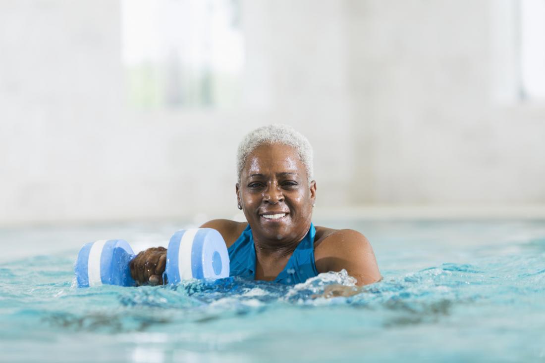 older lady doing water aerobics
