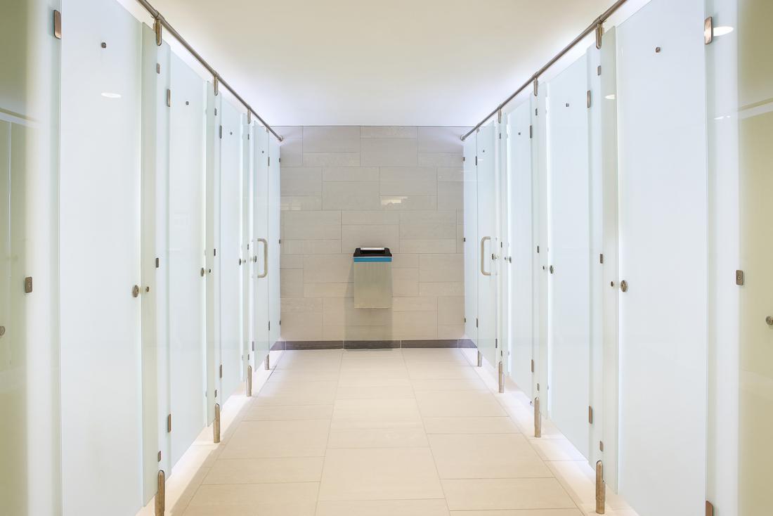 Public restroom with clean toilet cubicles.