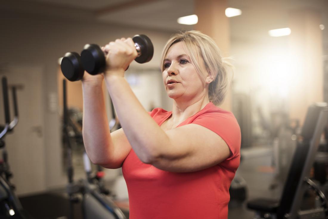 woman training with weights