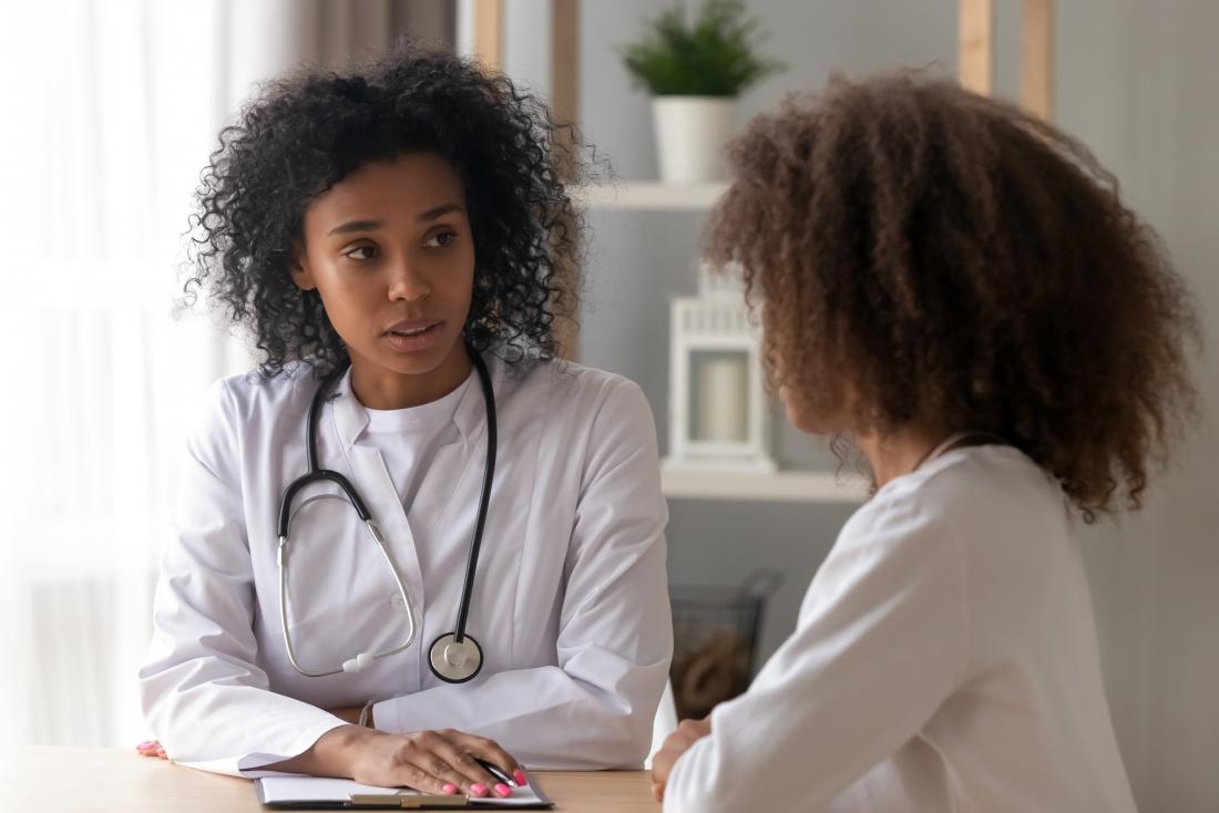 woman receiving breast cancer consultation