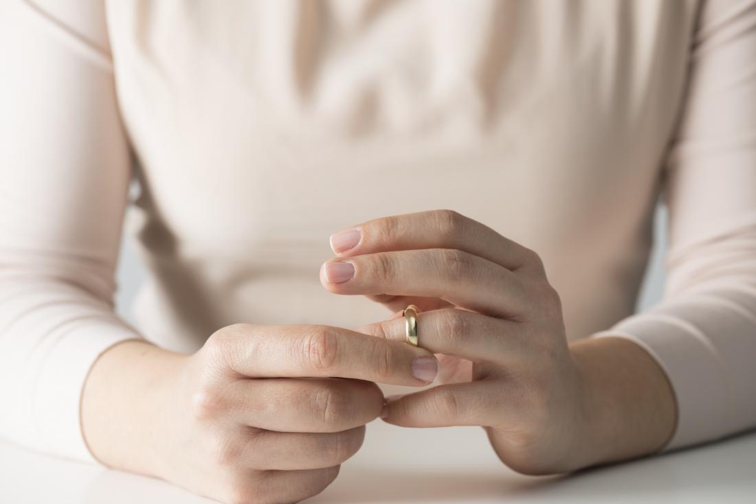 woman taking off jewellery