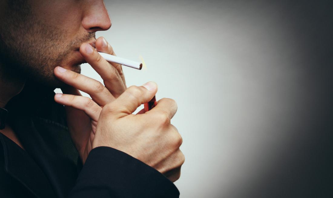Man lighting up a cigarette
