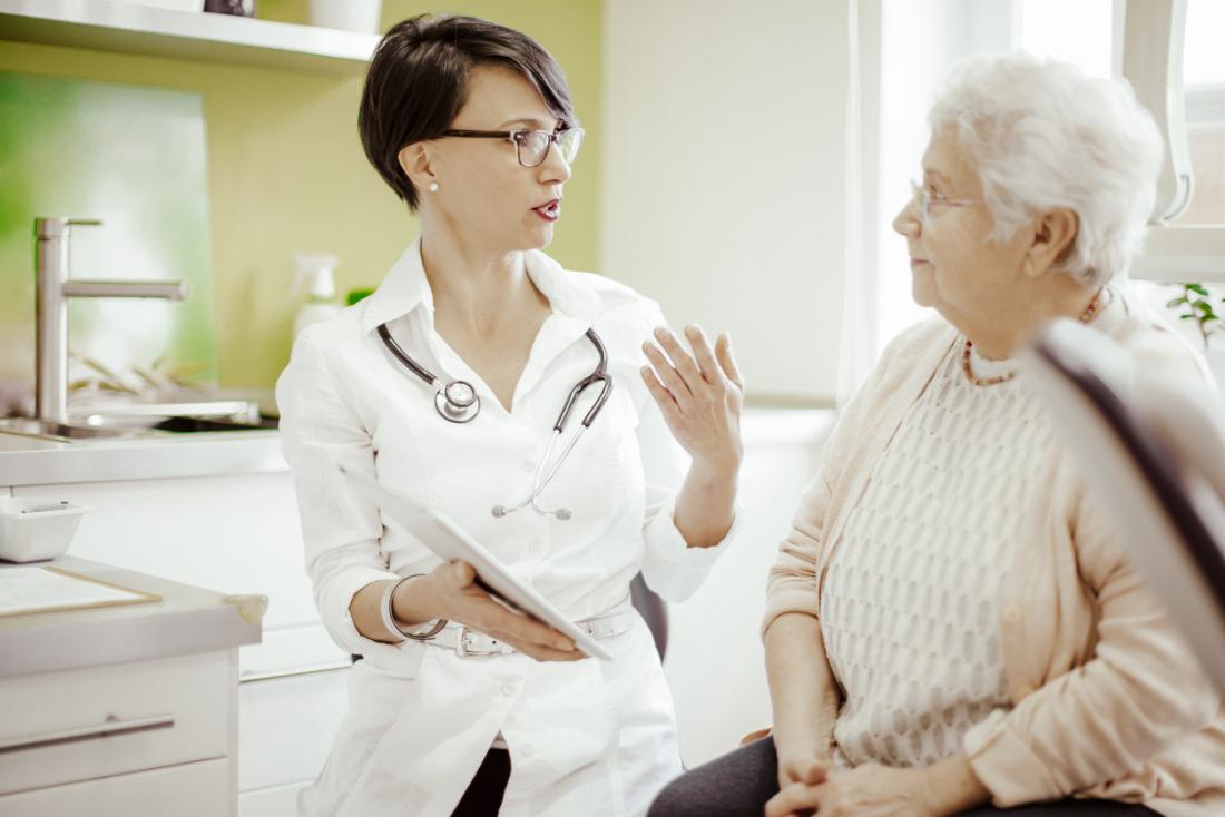 senior lady talking to doctor