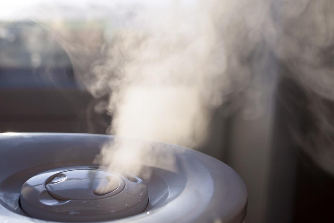 A humidifier machine releasing vapor in a home.