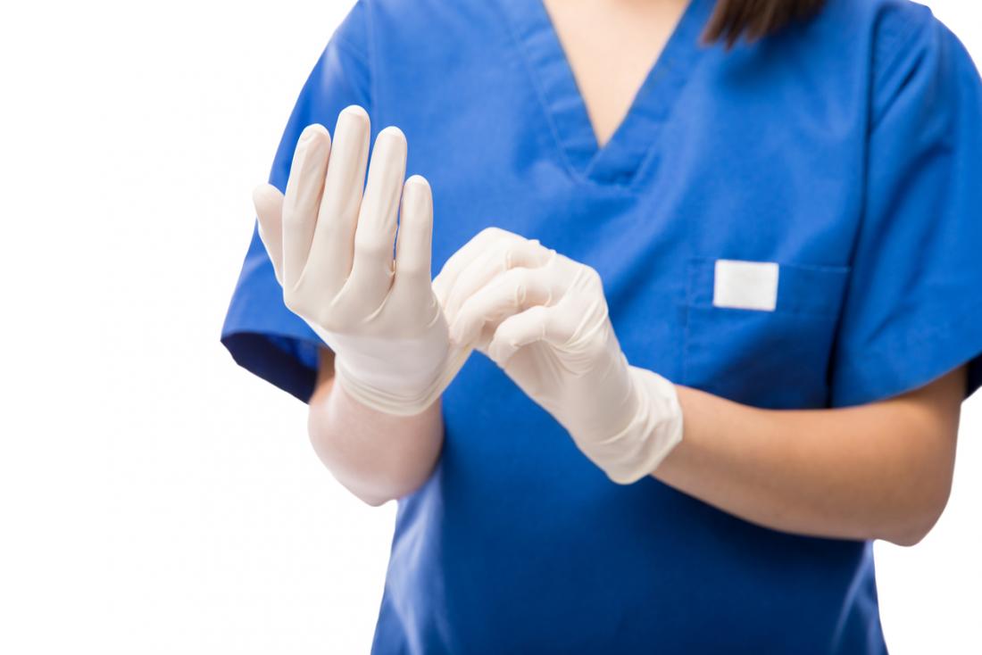 nurse putting gloves on
