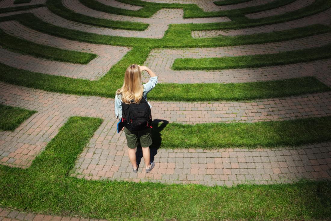 woman navigating her way out of a maze