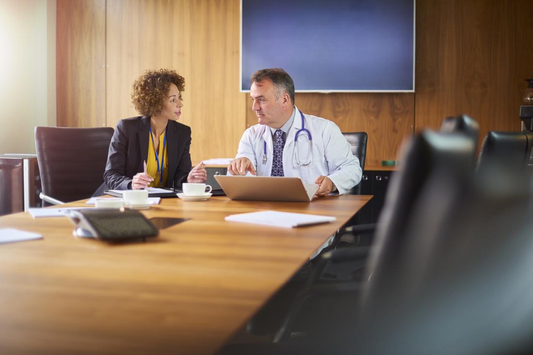 doctor in discussion with his assistant