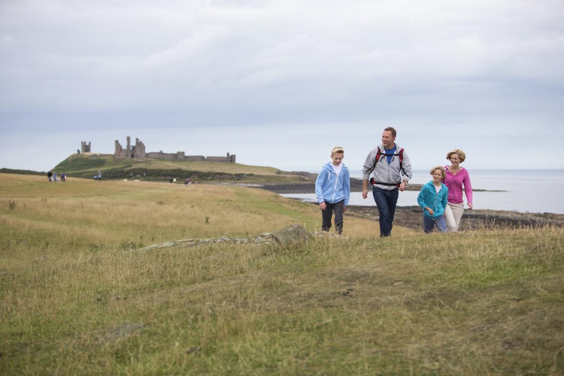 family walking in the countryside