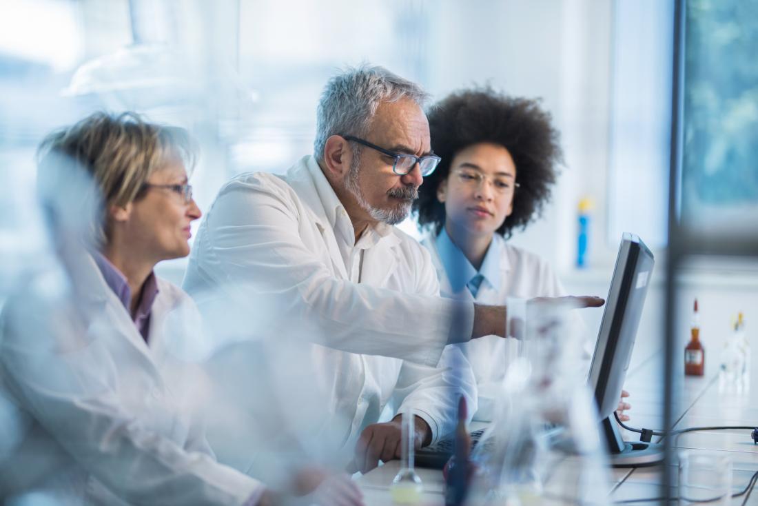 scientists examine DNA structure