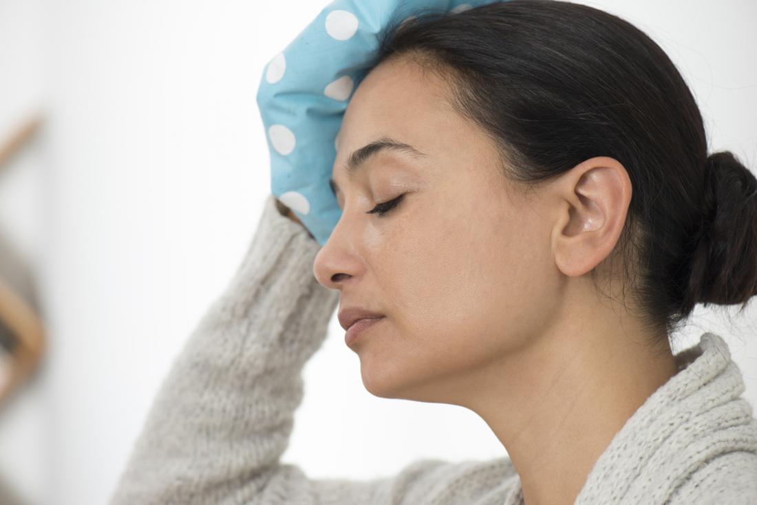 Lady using an ice pack on her head
