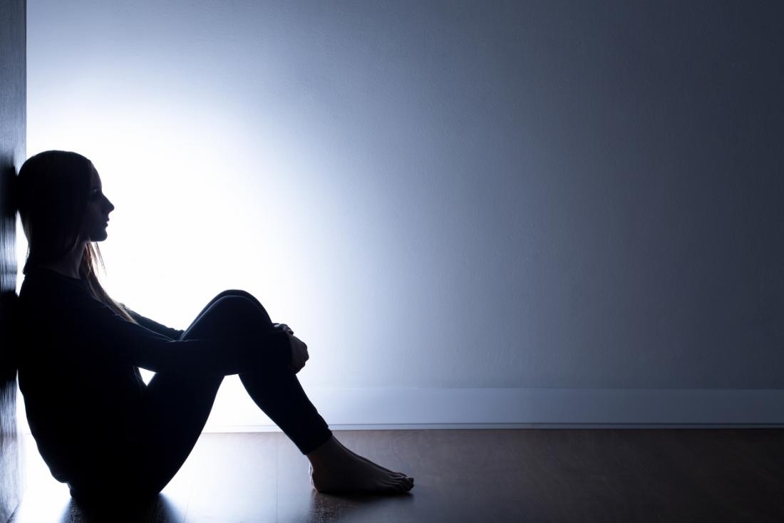 girl-sitting-on-the-floor-in-the-dark.jpg