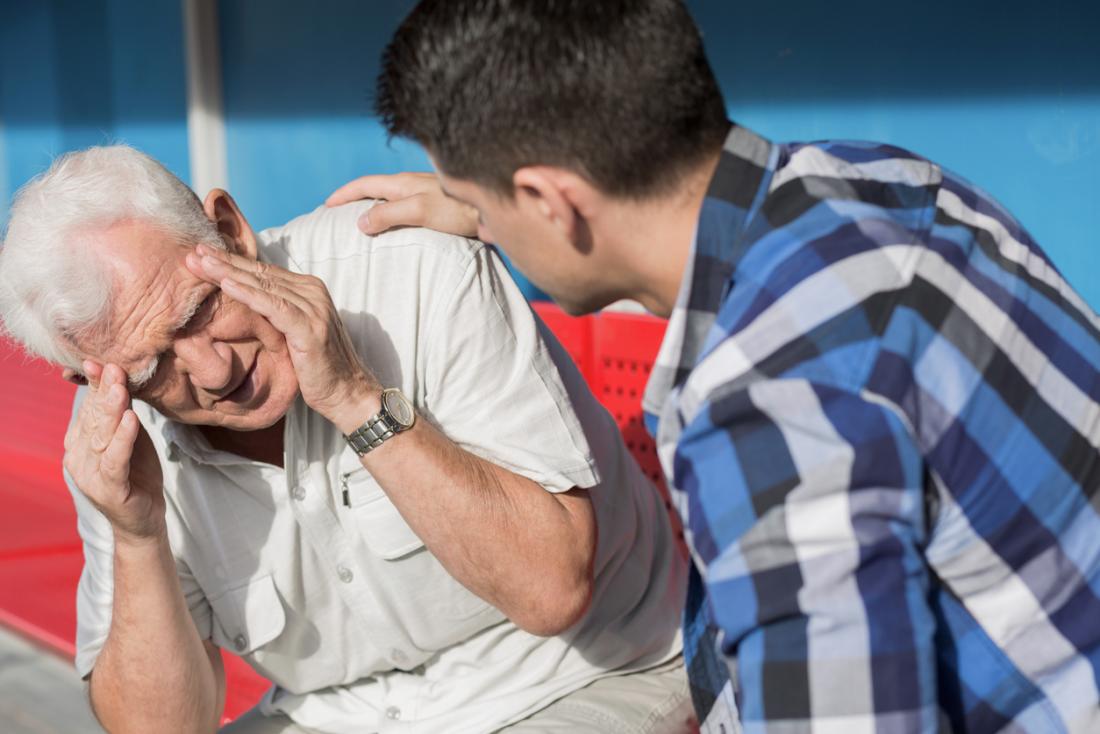Senior man suffering from dizziness, headache, and fatigue.