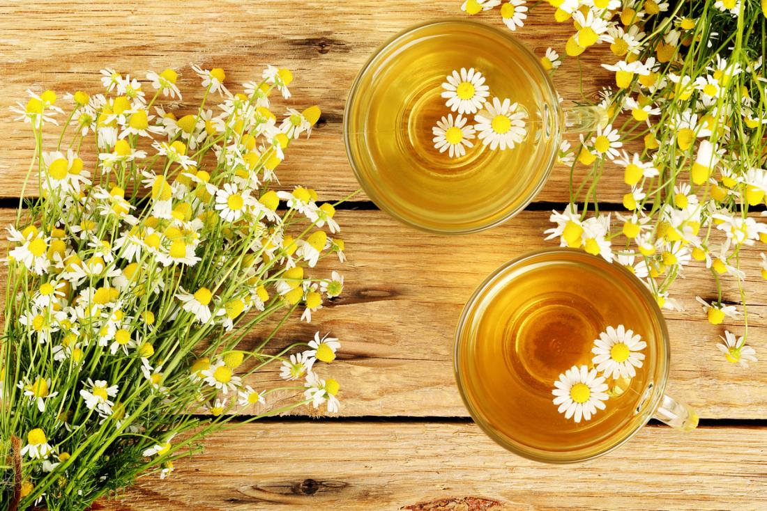 Chamomile tea on a board